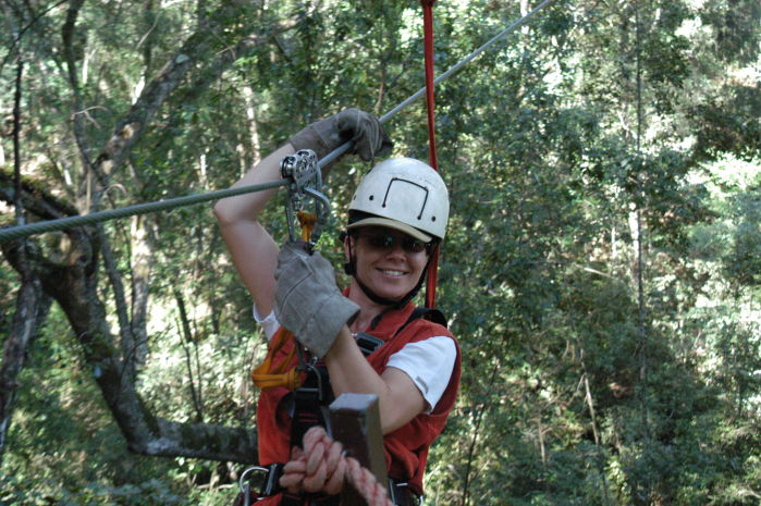 Sandra gliding from treetop to treetop in Tsitsikama National Park